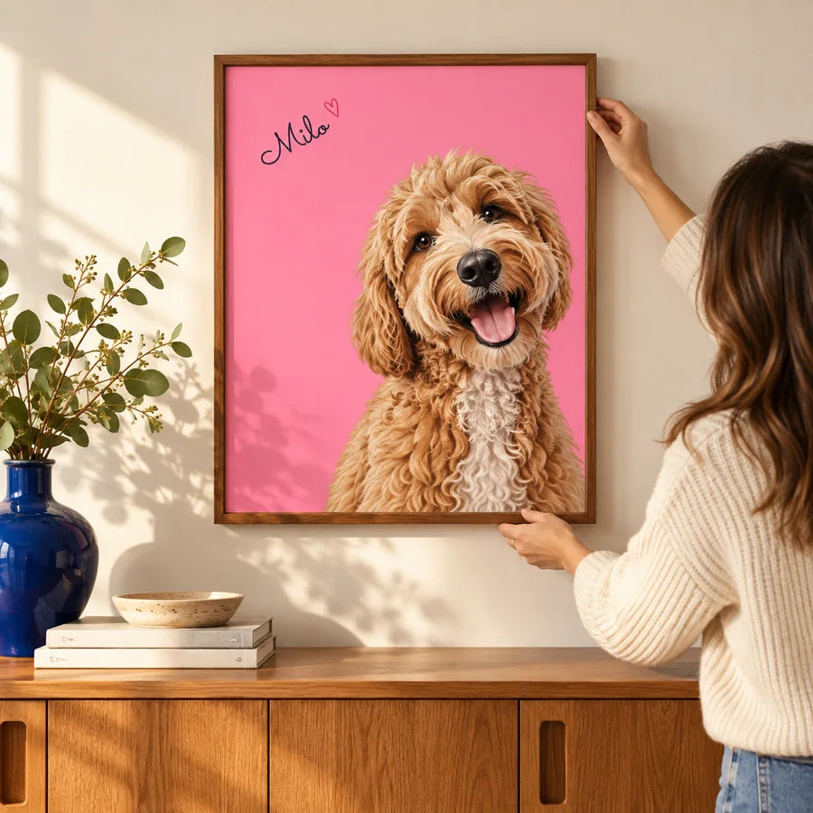 Pink Milo Color Pop portrait being hung above an oak cabinet